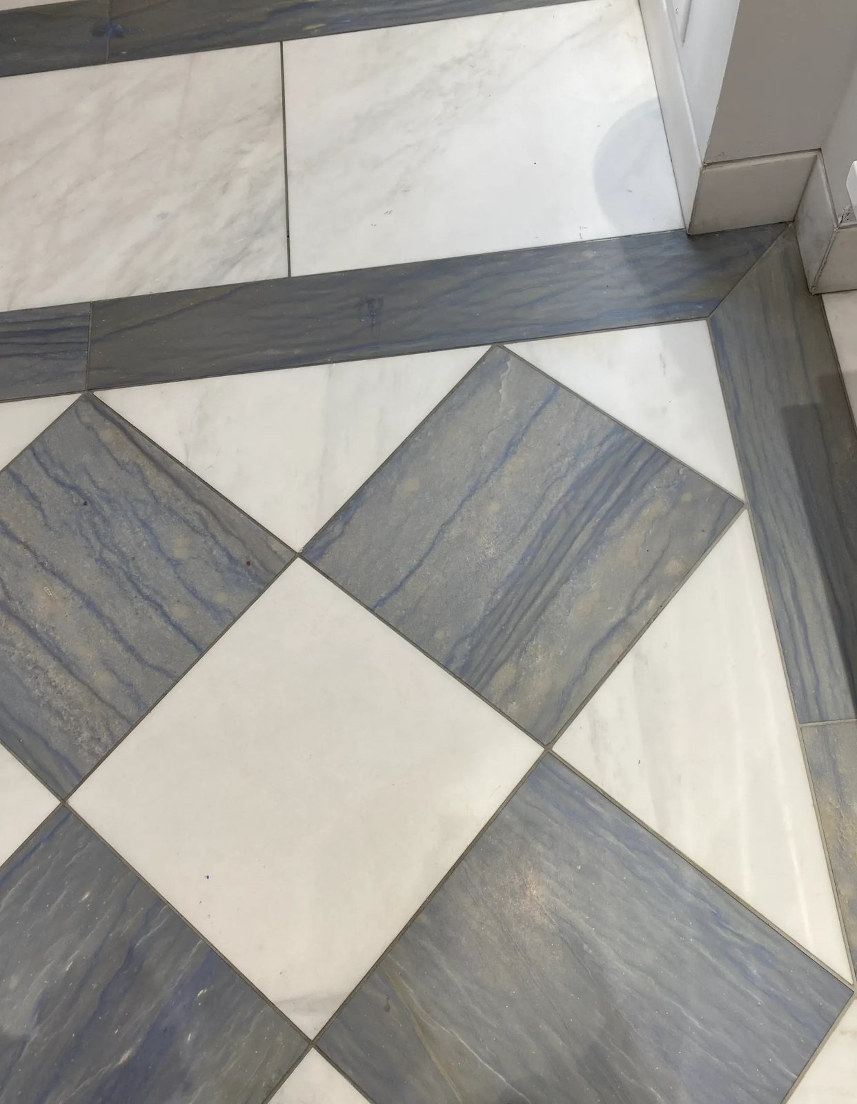 Diamond-set blue quartzite and white marble with a matching quartzite border.