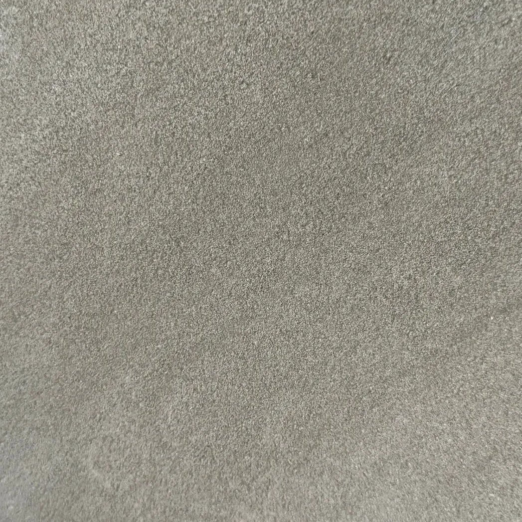 Pietra Serena limestone tile — Deep charcoal grey with a uniform, fine texture.