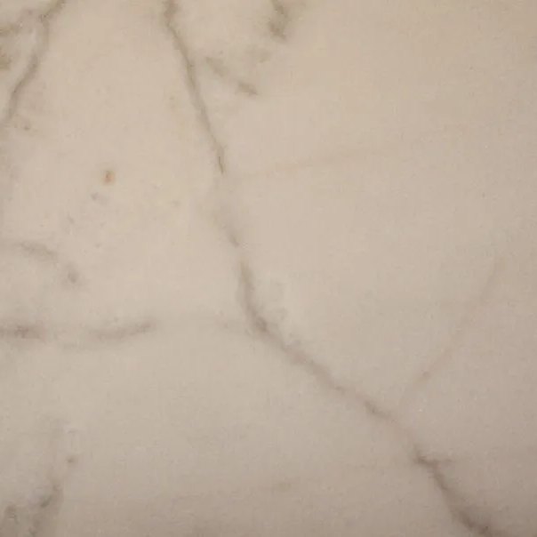 Calacatta italian marble tile — Soft white with fine, elegant grey veining.