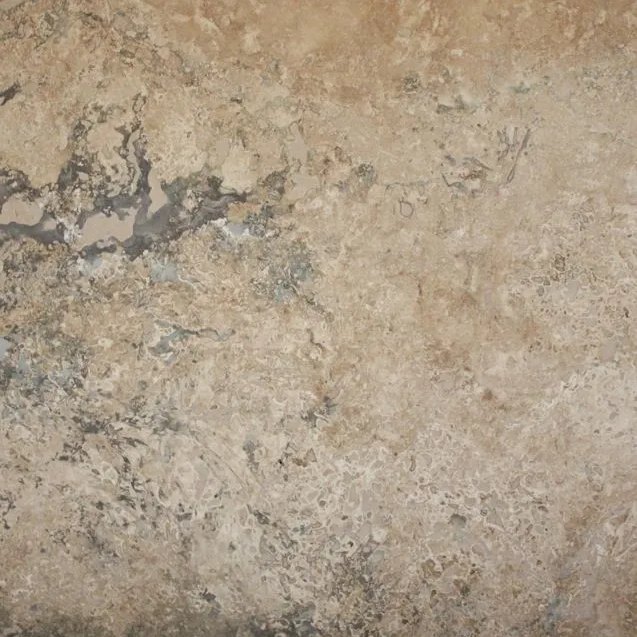 Sienna travertine tile — Golden walnut brown with dramatic grey clouding.